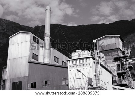 Norway, Hordaland county. Odda steel mill, abandoned factory. Black and white vintage style.