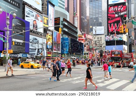 NEW YORK, USA - JULY 4, 2013: Tourists and local people visit Times Square in New York. The square at junction of Broadway and 7th Avenue has some 39 million visitors anually.