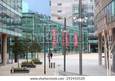MANCHESTER, UK - APRIL 22, 2013: People visit MediaCityUK in Manchester, UK. MediaCityUK is a 200-acre development completed in 2011, used by BBC, ITV and other companies.