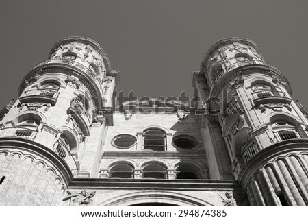 Malaga in Andalusia, Spain. Cathedral church - old religious landmark. Black and white tone - retro monochrome color style.