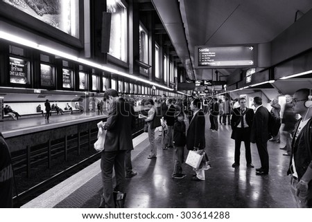 PARIS, FRANCE - JULY 20, 2011: People wait for Metro in Paris, France. Paris Metro is the 2nd largest underground system worldwide by number of stations (300).