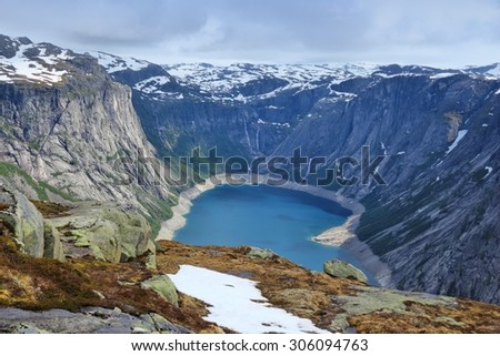 Norway hiking trail - path to Trolltunga (Troll\'s Tongue) rock in Hordaland county. Ringedalsvatnet lake.