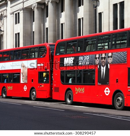 LONDON, UK - MAY 13, 2012: Hybrid London Buses in London. As of 2012, LB serves 19,000 bus stops with a fleet of 8000 buses. On a weekday 6 million rides are served.