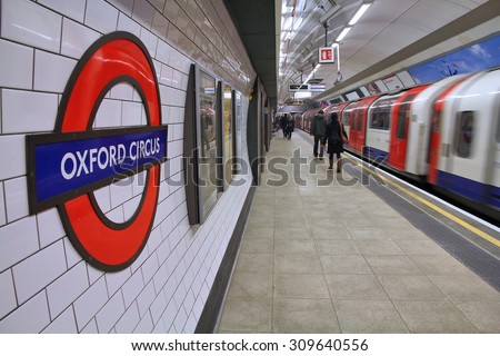 LONDON, UK - MAY 14, 2012: Travelers hurry at Oxford Circus underground station in London. London Underground is the 11th busiest metro system worldwide with 1.1 billion annual rides.