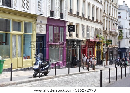 PARIS, FRANCE - JULY 22, 2011: Tourists visit Montmartre district in Paris, France. Paris is the most visited city in the world with 15.6 million international arrivals in 2011.