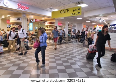 PISA, ITALY - MAY 4, 2015: Travelers hurry at Pisa International Airport in Italy. The airport served 4,683,811 passengers in 2014.