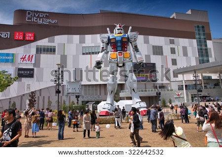 TOKYO, JAPAN - MAY 11, 2012: People visit Gundam robot replica in Odaiba,Tokyo. The sculpture is 18m tall and is the tallest replica of famous anime franchise robot, Gundam.