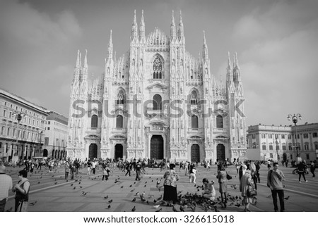 MILAN, ITALY - OCTOBER 7, 2010: Tourists visit Piazza Duomo in Milan, Italy. As of 2006, Milan was the 42nd most visited city worldwide, with 1.9 million annual international visitors.