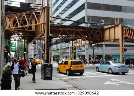 CHICAGO, USA - JUNE 26, 2013: People walk downtown in Chicago. Chicago is the 3rd most populous US city with 2.7 million residents (8.7 million in its urban area).