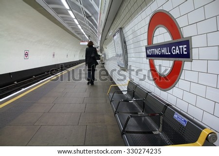 LONDON, UK - MAY 14, 2012: Person waits at Notting Hill Gate underground station in London. London Underground is the 11th busiest metro system worldwide with 1.1 billion annual rides.