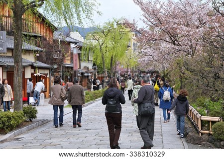 KYOTO, JAPAN - APRIL 14, 2012: People enjoy cherry blossom in Kyoto Old Town, Japan. 13,413,600 foreign tourists visited Japan in 2014.