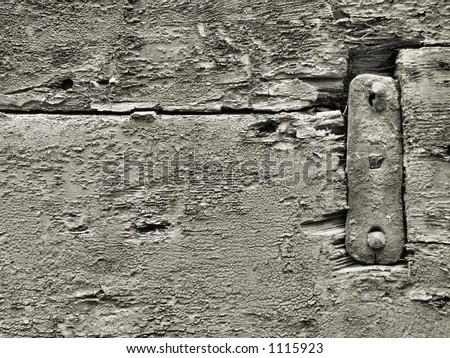 Old black and white wood rough surface - nice background pattern with cracks and crevices with a metal steel element