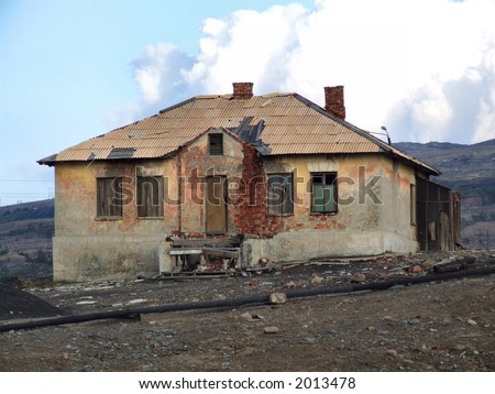 A ruined old brick house in Russia. Industrial wasteland.