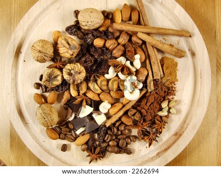Mixture of nuts and dried fruit with coffee beans and other stuff. Christmas cuisine concept.