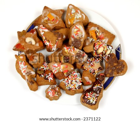 Colorful and sweet cookies on a plate. Christmas cuisine.