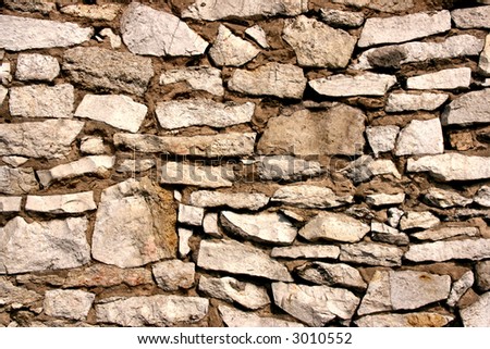 Stone wall texture. Background made of white stones.