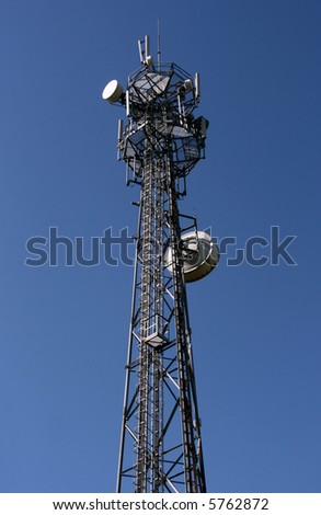 Wireless technology - mobile cellural phones development. Cell tower and blue sky.