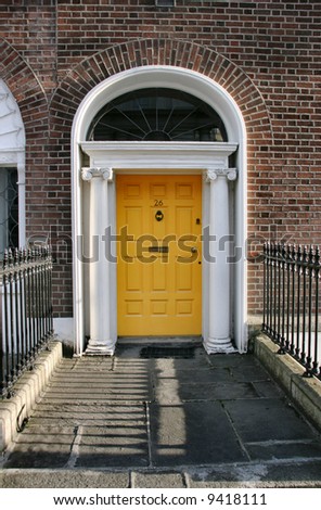 Georgian architecture of Dublin - yellow door in old building