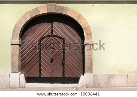 Old wooden door in Budapest. Beautiful vintage architecture.