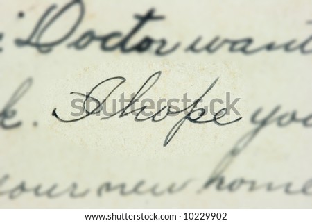 Vintage hand writing on a letter. Old paper with visible structure. Pen ink. I hope words.