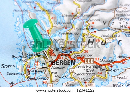 Bergen, Norway, Europe. Push pin on an old map showing travel destination. Selective focus.