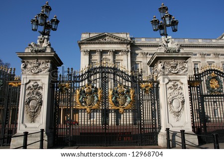 Buckingham Palace decorated metal gate. Coat of arms. Famous landmark of London, England.