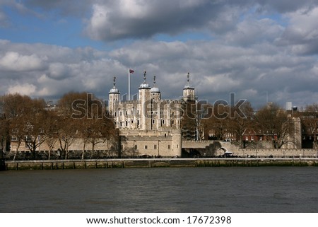 Tower of London - the medieval castle and cloudy sky. Famous architecture of Great Britain.