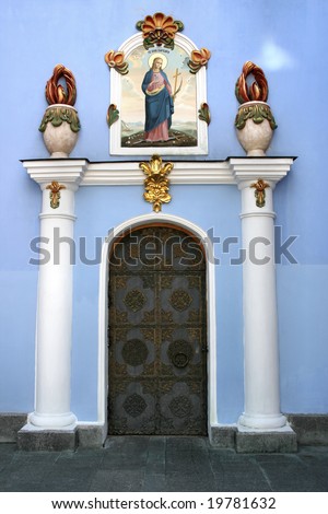 Decorative door to St. Michael\'s Golden-Domed Monastery in Kiev, Ukraine. Above the door is a painting with Saint Barbara.