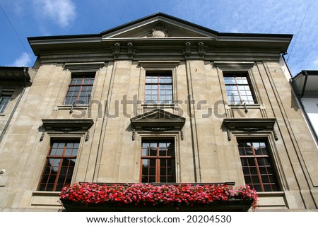 Balcony with flowers in Winterthur, Switzerland. Local landmark in summer.