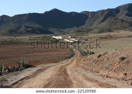 Spanish landscape. Desolate rural area in mountains of Andalusia. Agave plants. Cabo de Gata natural park near Almeria.