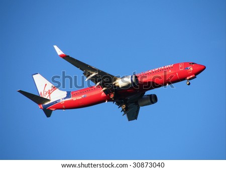 GOLD COAST - MARCH 24: Virgin Blue Boeing 737 lands at Coolangatta Gold Coast Airport on March 24, 2009 in Gold Coast. Virgin Blue is Australia\'s second-biggest airline by fleet size.