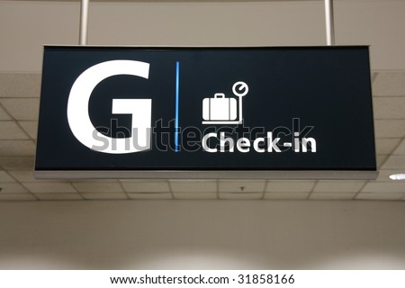 Sydney International Airport check-in illuminated sign