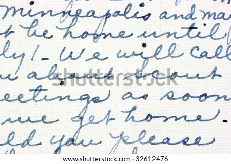 Vintage hand writing on a letter. Old paper with visible structure. Pen ink.