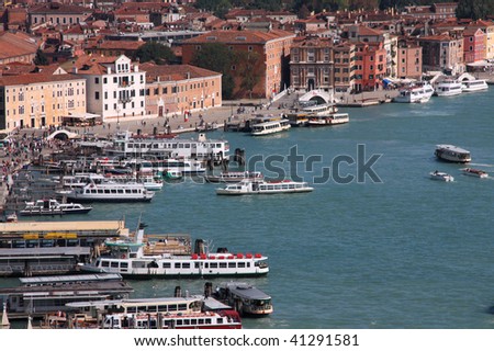 Aerial view of Venice waterfront. All sorts of water transportation: boats, ships, ferries, motorboats.