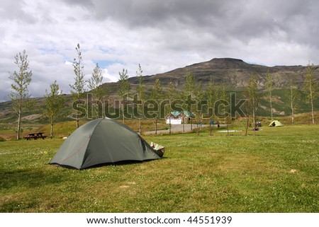 Campground tents in Geysir - famous tourist area in Iceland. Summer camping.