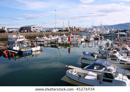 Reykjavik harbor. Motorboats, yachts and small fishing ships. All brand names and registration numbers removed.