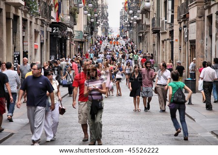 BARCELONA - SEPTEMBER 13: Tourists strolling the famous Carrer de Ferran on September 13, 2009 in Barcelona. It is one of the busiest pedestrian areas in Barcelona, connecting famous Rambla boulevard.