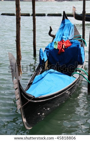 Famous Venetian gondola - passenger transportation boat typical for Venice, Italy