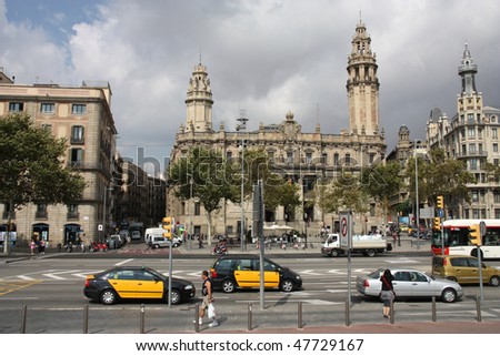 BARCELONA - SEPTEMBER 14: Taxi cabs in front of famous post office on September 12, 2009 in Barcelona. There are more than 10,000 yellow-black taxicabs in Barcelona, most operated by private owners.