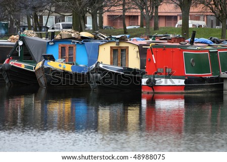 Birmingham water canal network - colorful living barges, typical houseboats. West Midlands, England.