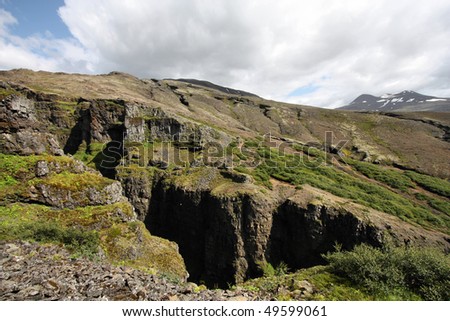 Beautiful mountains in Glymur area, Iceland. Deep, dark ravine.