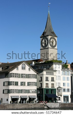 Zurich cityscape. St. Peter\'s Church tower with world\'s largest church clock face. Swiss city.
