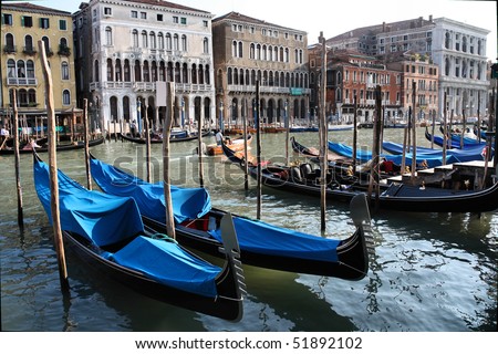 Canal Grande and famous gondolas - passenger transportation boats typical for Venice, Italy