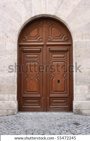 Old wooden door in Valladolid, Spain. Architecture exterior.