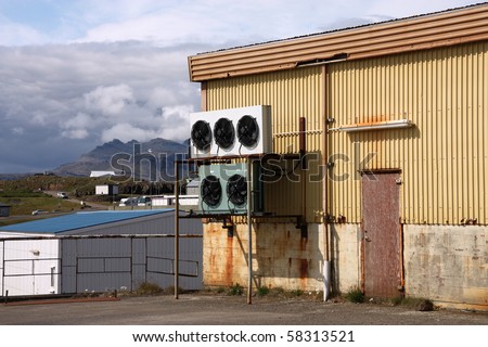 Old warehouse with industrial cooling fans, small town in Iceland