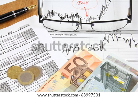 Business composition. Financial analysis - income statement, ink pen, glasses and Euro money.
