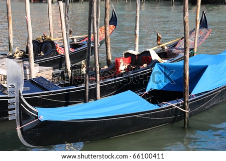 Gondola - passenger transportation boats typical for Venice, Italy. Canal Grande.