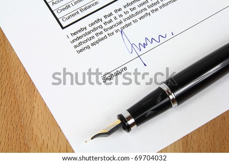 Signature under a business contract agreement with a fountain pen. The signature is fictional.