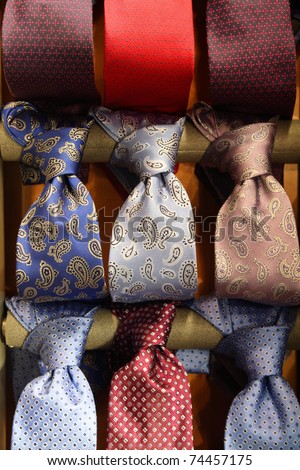 Shopping for elegant dressing accessories. Colorful ties at a shop in Italy. Formal wear selection in a store.