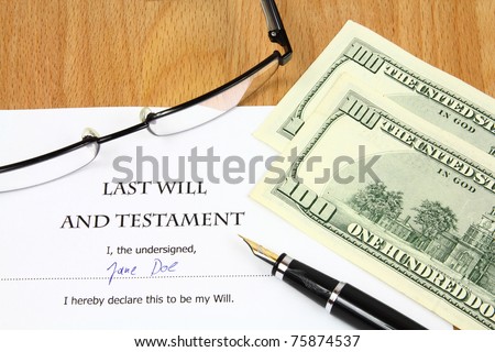 Last Will and Testament with a fictitious name and signature. Document, US dollar money, glasses and fountain pen.